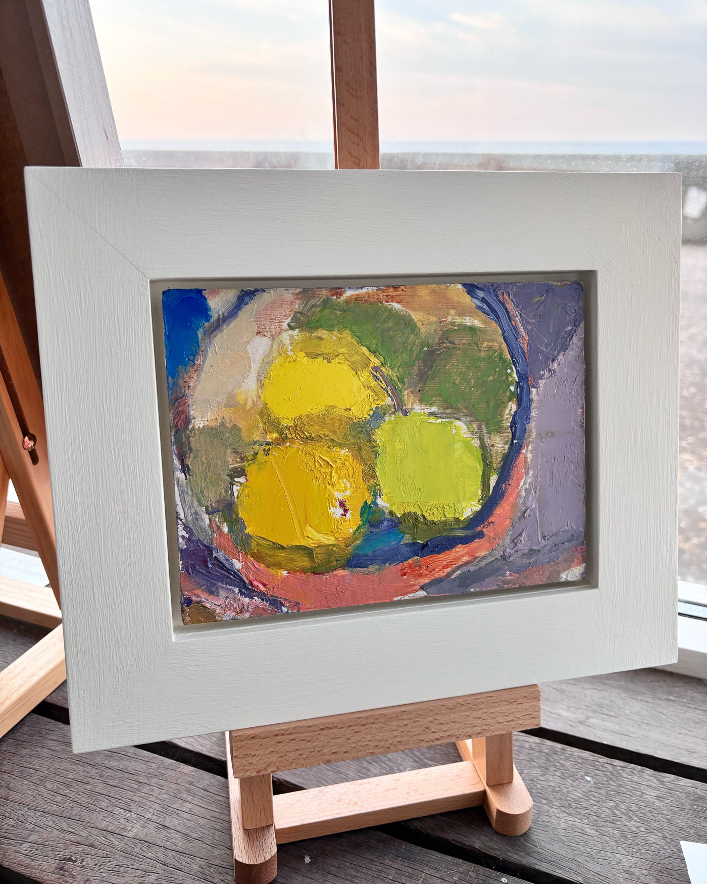 Apples in a red bowl, by Michael Weller